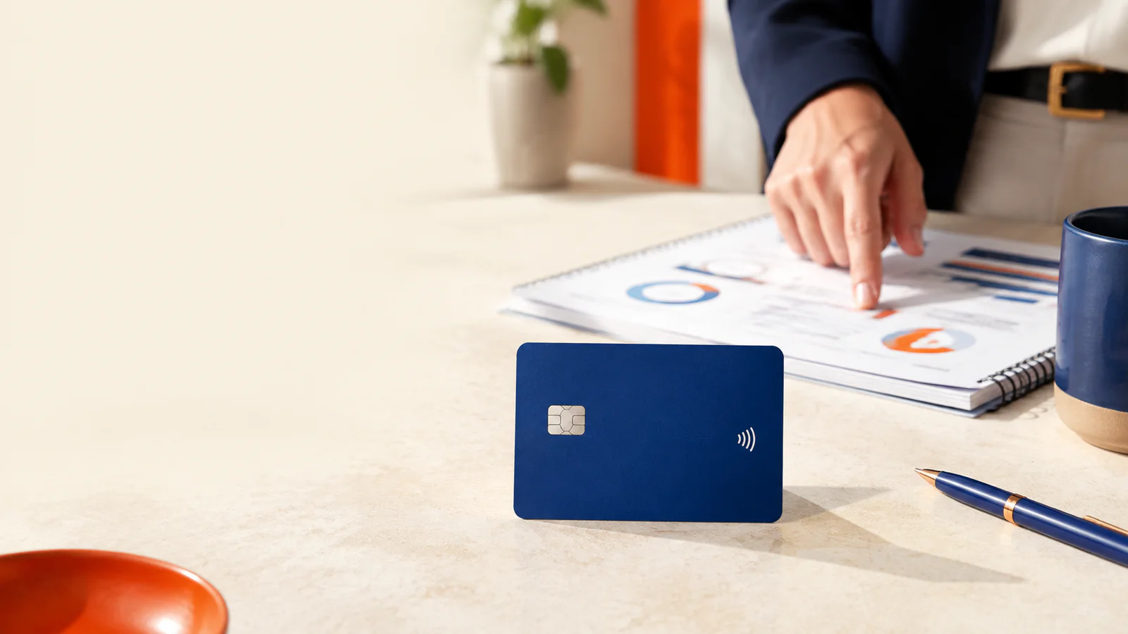 A clearly recognizable payment card with chip and contactless symbol on a Shopify incentive planning desk